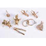 A small group of 9ct gold charms and earrings: comprising a pair of fuchsia flower drop earrings;