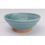 An early 20th century Omega Workshops turquoise glazed bowl: the outer reeded angular section