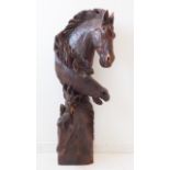 An unusual vertical driftwood carving of three horses heads: the top example with long flowing
