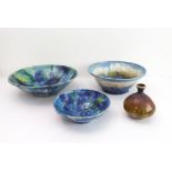 Three mottled blue and green studioware pottery bowls (the largest 34.5 cm in diameter), together