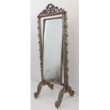 A late 19th to early 20th century Louis VI style silver-painted cheval mirror: pierced ribbon