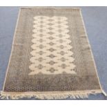 A modern Pakistan rug: beige ground with multiple stylised patterns (131cm long x 127cm wide)