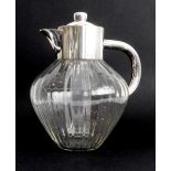 A late 19th or early 20th century silver-plate-mounted clear-glass lemonade jug: the lid