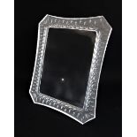 A large and heavy Waterford crystal photo frame with etched decoration to the reverse of the concave