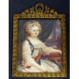 A 19th century rectangular gilt-metal-framed portrait miniature on ivory of a noblewoman seated in