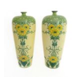 A pair of Frank Beardmore & Co. (Fenton) vases in Art Nouveau style: tapering baluster form; the