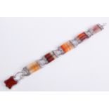 An antique Scottish silver and agate bracelet: unmarked, the five triple reeded striped agate