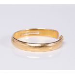 A 22ct yellow gold wedding band: (has been cut, 3.2g).