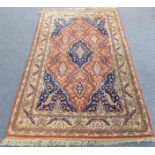 A modern Persian Tabriz carpet: central medallion with cobalt blue spandrels (overall good