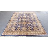A large Persian Tabriz carpet (contemporary): cobalt blue and lighter blue ground with various