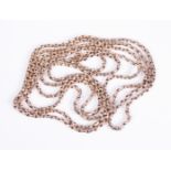 An antique 9ct rose gold guard chain: marked '9C', the faceted cable link chain approx. 140 cm long,