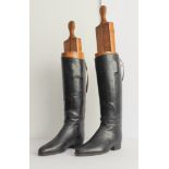 A pair of black leather riding boots with trees: interior gilded maker's mark of 'Moykopf -