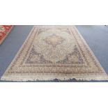 A large Kashmir carpet: light turquoise ground with central medallion and palmette spandrels,