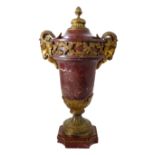 A 19th century gilt-metal-mounted and rouge variegated marble urn and cover: the domed cover