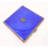 A hallmarked silver cigarette case with blue guilloché enamelling: central applied crown motif and