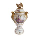 A 19th century German porcelain (probably Meissen) porcelain urn and cover: the dome-topped reeded