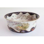 A fine Japanese satsuma bowl: the interior hand-gilded and painted with two peacocks, one with
