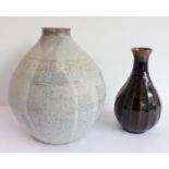 Two pieces of studio ware: 1. a pottery vase of ovoid form, predominately grey trailing glazes