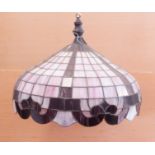 A very large Tiffany-style leaded light lampshade of domed form: pink and white trailing glass