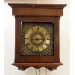 A late 17th century weight driven hooded wall clock: unsigned, the 8¼ in square brass dial with