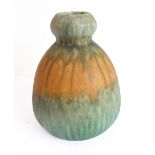 An early 20th century Ruskin Pottery vase: stylised double-gourd form with multicoloured trailing