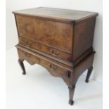 A mid-18th century oak chest-on-stand: the two-plank top with cleated front and ends above a