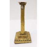 An 18th century miniature table candlestick of Corinthian form: separate drip-pan; reeded and fluted