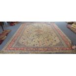 An early 20th century Turkish Sivas carpet: ivory field with three small central lozenges, all