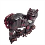 A 19th century carved Chinese Dog of Fo (Karashishi) style beast (possibly red amber): the animal