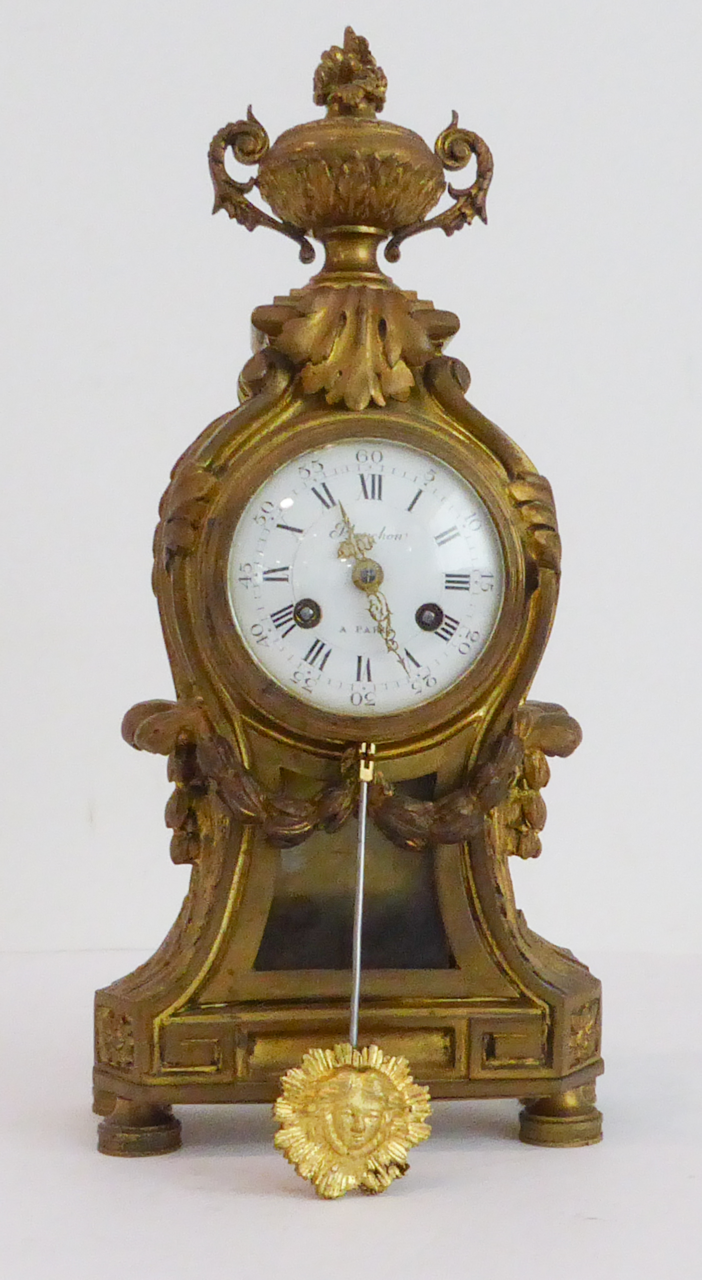 A 19th century French gilt-metal-cased eight-day mantle clock in Louis XVI style. The two-handled