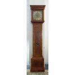 A walnut veneered and feather-banded eight-day longcase clock: the 12-inch brass dial behind a