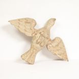 An unusual naïve vernacular carving (possibly limewood) of an open-winged bird with feet and legs