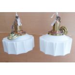 A pair of brass and copper mounted Art Deco style ceiling hanging lamps: brass link chain to an