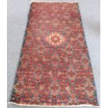 A modern Hamadan rug (reduced in size): blue ground with herati pattern, centrally decorated with