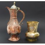 A late 19th to early 20th century Middle Eastern copper coffee pot and a similar period Islamic