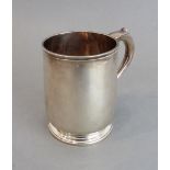 An early 18th century heavy hallmarked silver (Britannia standard) mug: capped scrolling handle