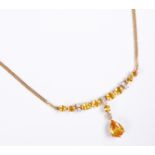 A yellow sapphire, diamond-set and 18-carat yellow gold necklace: the front section composed of four