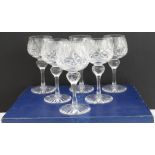 A boxed set of six finely cut clear-glass hock glasses with star-cut bases