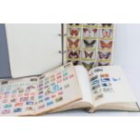 Three stamp albums: 1. Varying late 20th century worldwide, relating to butterflies; 2. Early to