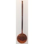 A large 19th century copper warming pan with pierced hinged top and extra long turned oak handle (