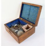 A small 19th century metal-mounted oak box (LWH 15.5 x 11.5 x 6.8 cm) and its contents to include