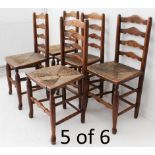 A set of six early/mid 19th century French provincial style ash ladderback chairs with rush seats;