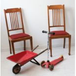 A mixed lot of four: 1. a pair of Edwardian oak dining chairs 2. a Brio wheelbarrow and a