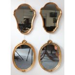 A pair of gilt-framed wall-hanging mirrors (55 cm tall x 41.5 cm widest point) together with two