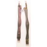 Two girths: a brown Dever 44 inch and a black leather 49 inch marked Jumpers Horse Line (2)