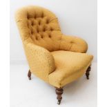 A 19th century mustard and red polka-dot upholstered (later) button-back armchair on short turned