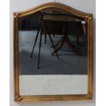 A modern arched gold framed looking glass with hand-bevelled plate (90.5cm high x 70.5cm wide)