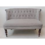 A buttonback taupe upholstered sofa on turned legs. (LWH 117 x 66 x 74 cm)