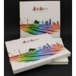 Two identical box-sleeved stamp albums containing a variety of modern commemorative mint Chinese