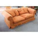 A large and modern mottled-orange upholstered sofa with scroll-style ends (LWH approx. 200  x 109  x